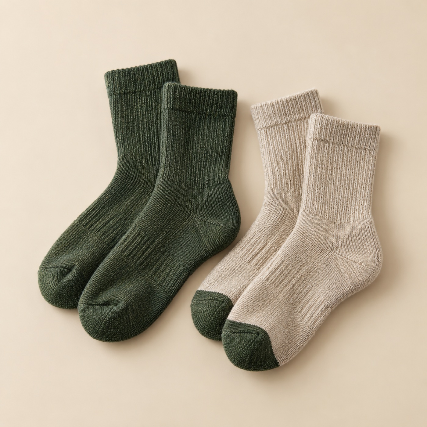 Pair of merino hiking socks in green and oat